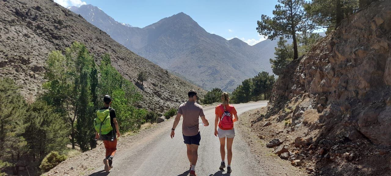 Hikers descending toward Imlil after the Talamrout Summit hike