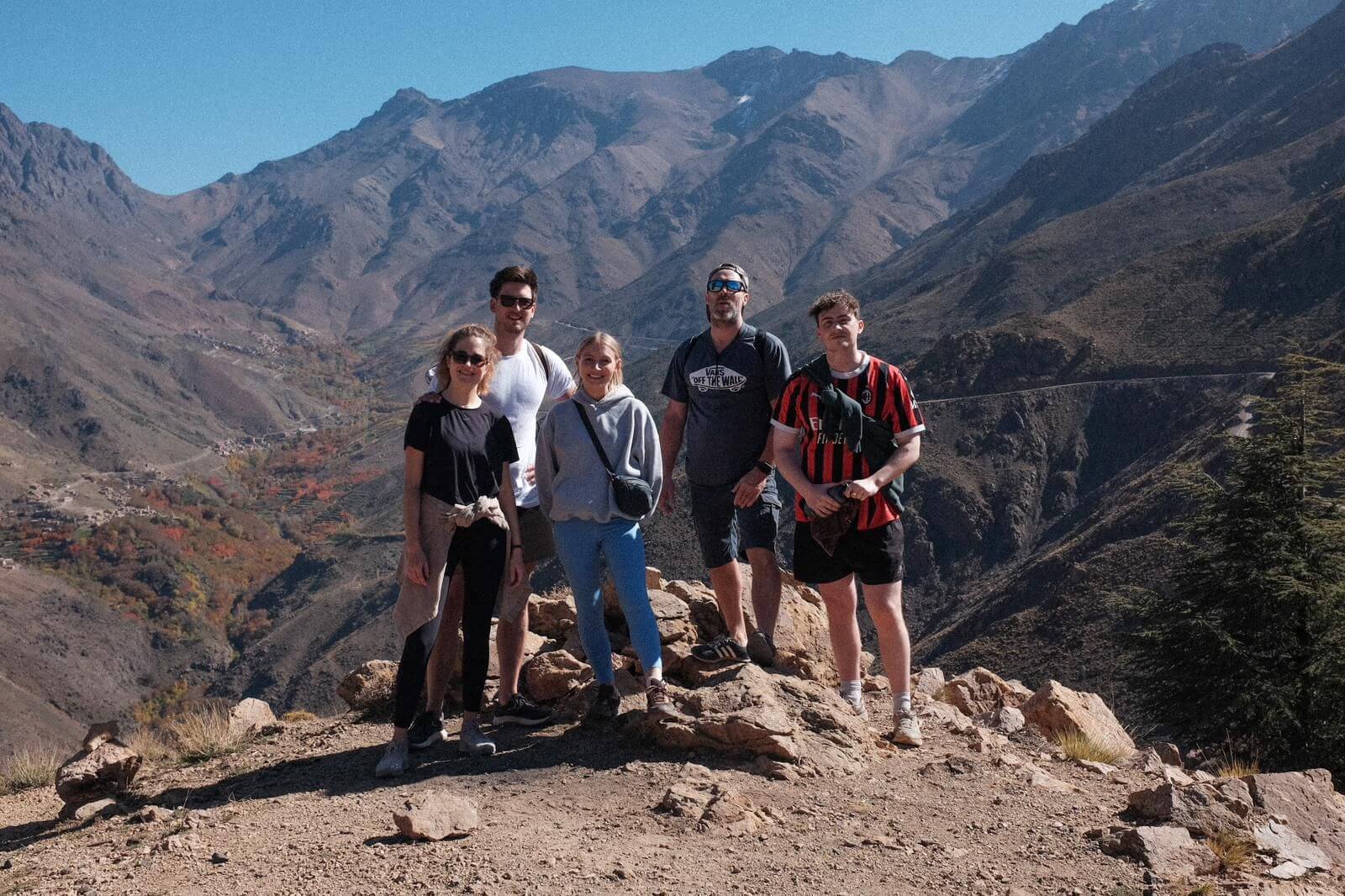 Hikers taking a break on the mountain trail near Talamrout Summit